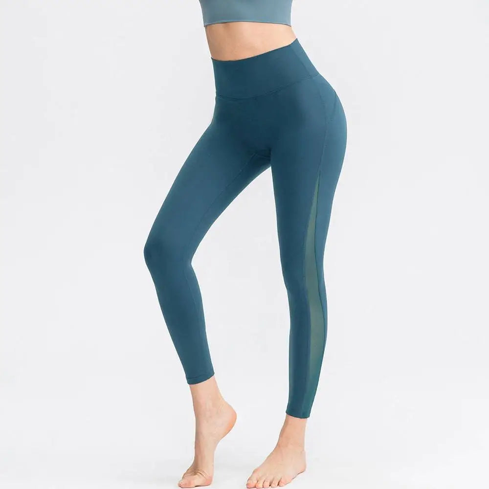 Light blue seamless high waisted yoga pants with sheer side panel designed as butt lifting workout leggings