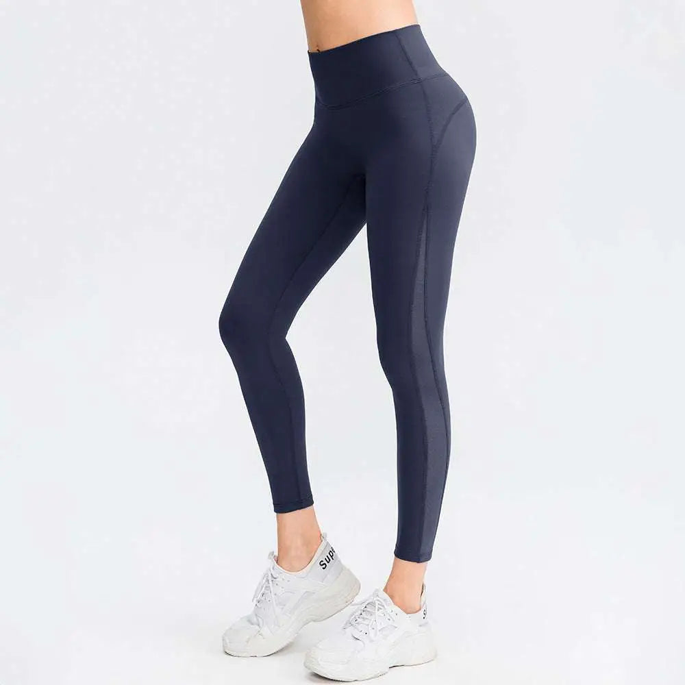 Dark navy seamless high waisted leggings with subtle side seams designed for butt lifting workout and lifting workout leggings