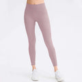 A pair of seamless high waisted lavender leggings made from stretchy fabric for butt lifting workout and lifting workout leggings