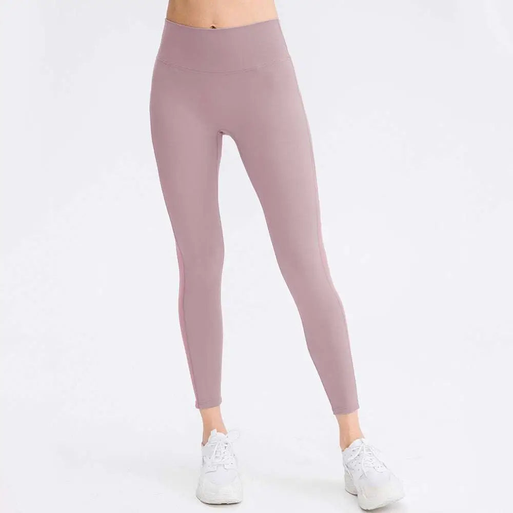A pair of seamless high waisted lavender leggings made from stretchy fabric for butt lifting workout and lifting workout leggings