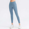 Light blue seamless high waisted yoga pants with subtle side paneling designed for butt lifting workout leggings