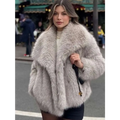 Light gray winter plush coat with voluminous faux fur texture and long sleeve design for cozy fashion wear