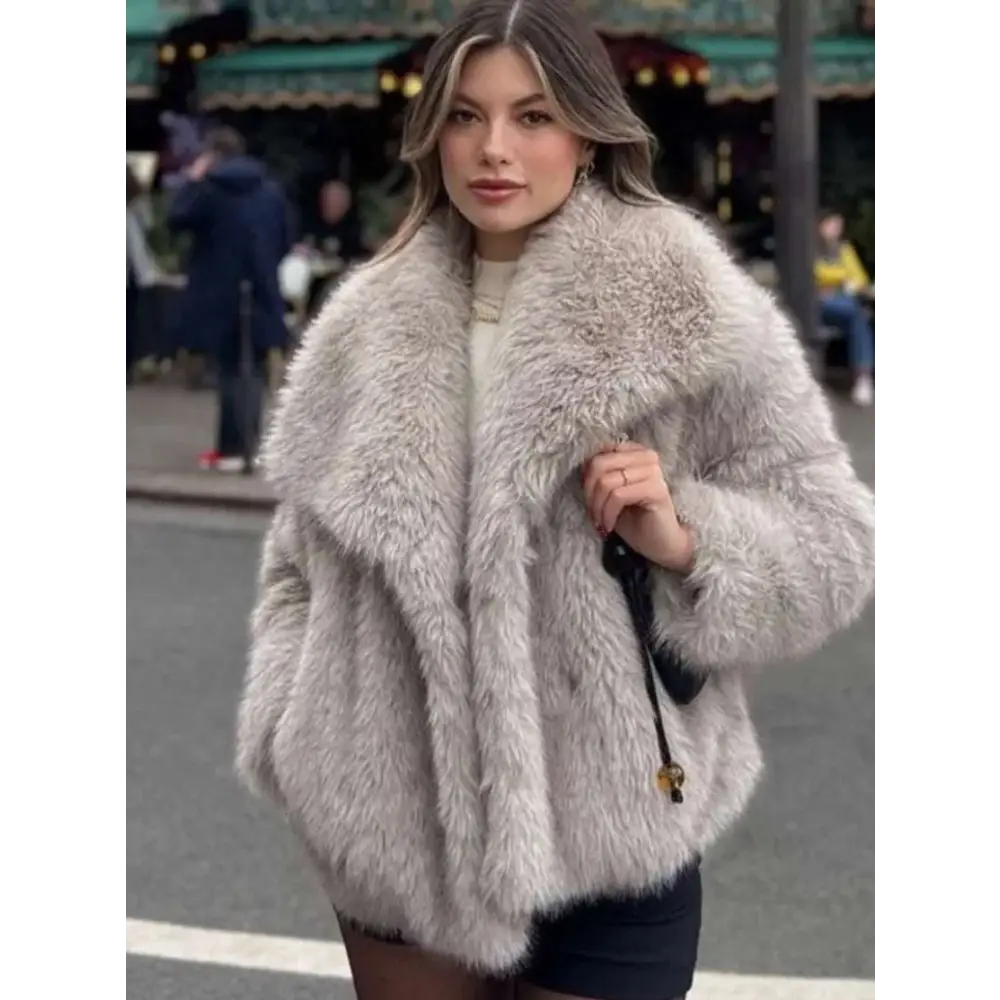 Light gray winter plush coat with voluminous faux fur texture and long sleeve design for cozy fashion wear