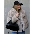 A light gray winter plush coat with a soft faux fur texture and long sleeve design featuring a wide collar