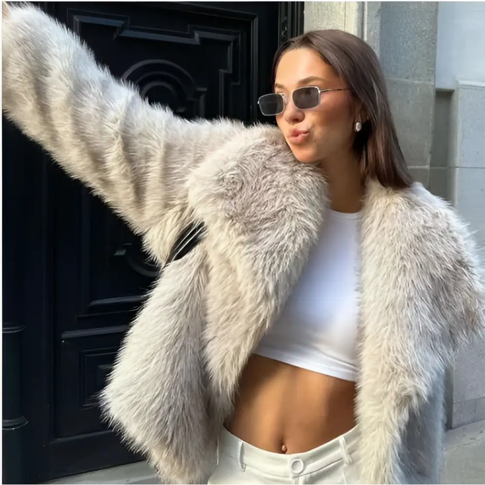 Light gray winter plush coat with a fluffy faux fur material and cozy oversized long sleeve design for cold weather