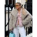 Light gray winter plush coat with plush textured surface and cozy oversized silhouette long sleeve design