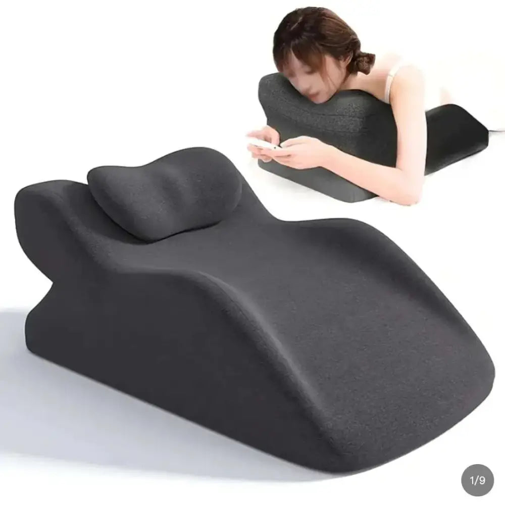 Black ergonomic neck and shoulder support pillow with contoured shape for comfort used with light green reclining chair stomach sleeper pillow