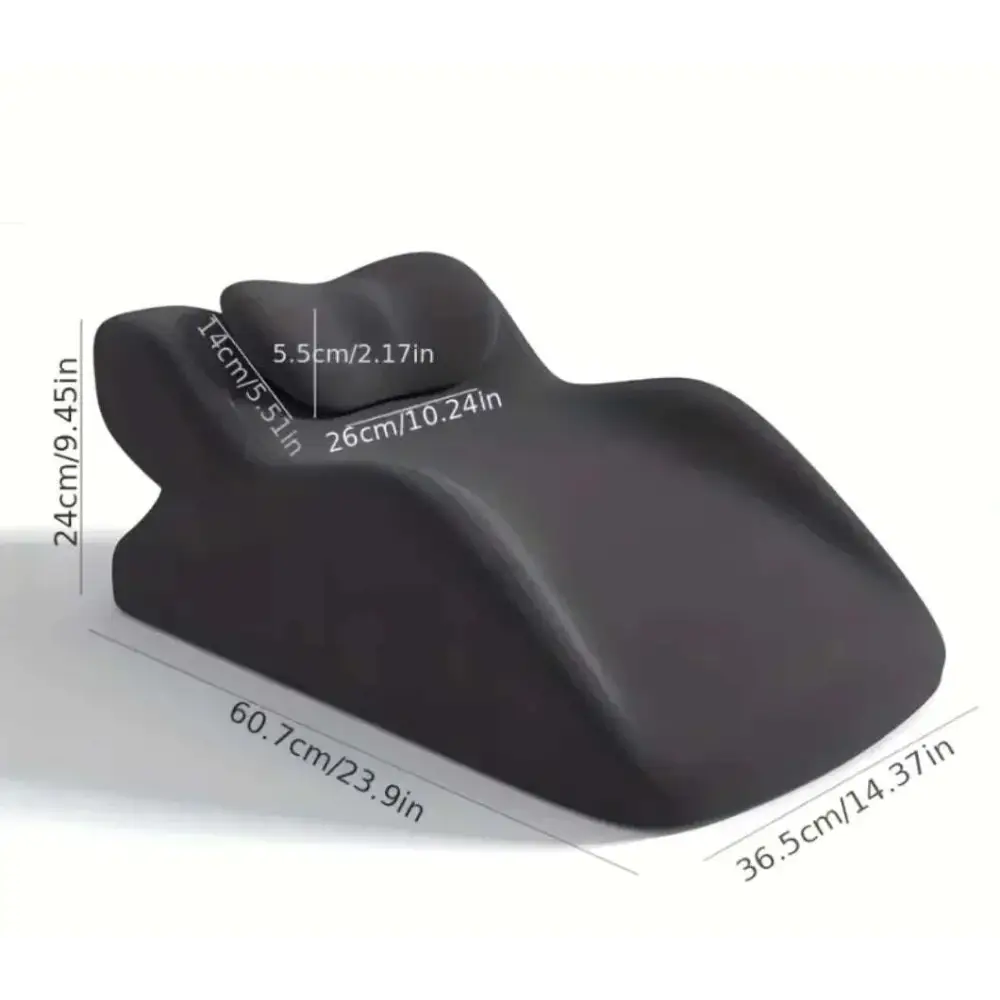 Black ergonomic lumbar support pillow with contoured shape complements light green reclining chair for stomach sleeper pillow use