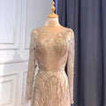 A luxury minority champagne beaded evening gown with long sheer sleeves and intricate gold patterns