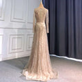 Light luxury minority champagne beaded evening gown with long sleeves and intricate beaded detailing on the back and skirt