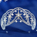 A sparkling silver crystal wedding tiara with rhinestones and pearls in a luxury socialite style design