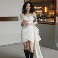 White off-the-shoulder ruched mini dress with flowing side train light wedding gown for women