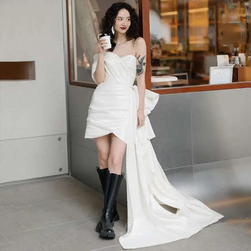 White asymmetrical satin mini dress with draped side train and ruched bodice light wedding gown white off-the-shoulder
