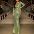 A shimmering lime green slim sequined mermaid gown with long sleeves and a one shoulder design