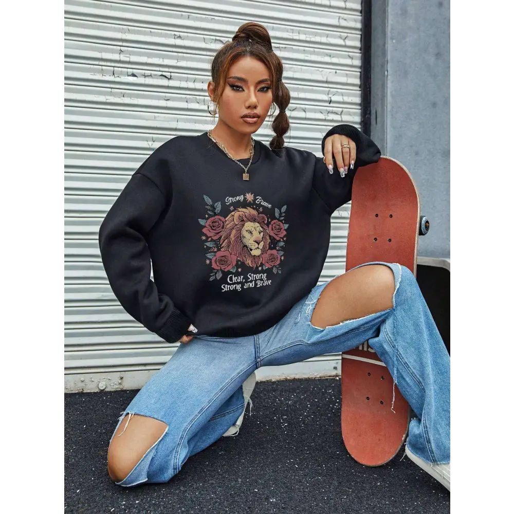 Black lion rose regular fit long sleeve sweatshirt with oversized lion and roses graphic and strong brave text design