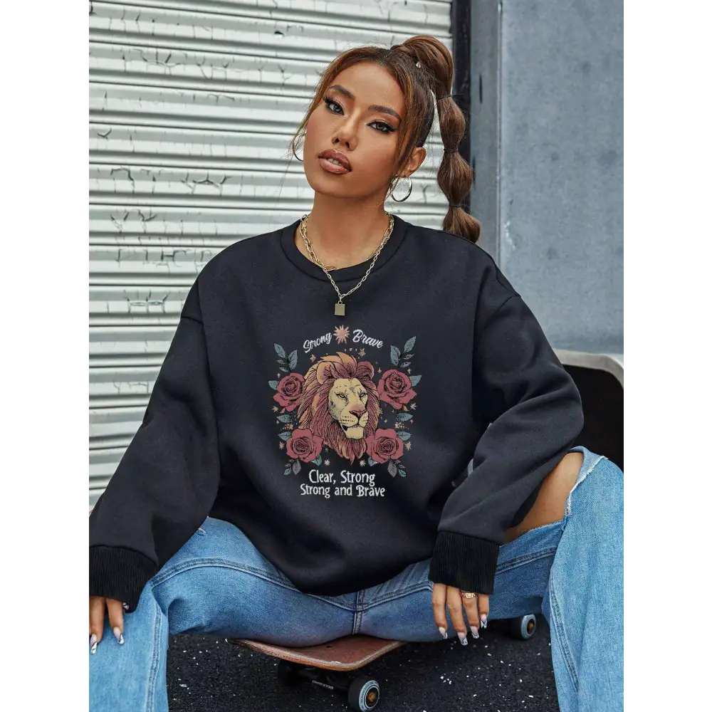 Black lion rose regular fit long sleeve sweatshirt with detailed lion graphic and roses featuring strong brave text