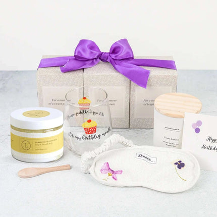 Lizush Trio Spa Gift Basket And Self Care Gifts For Women With Wine Glass, Candle, Grapefruit Body scrub, Eye Mask - Enjoy Every Moment - 4 Piece Set - Royalessencelux