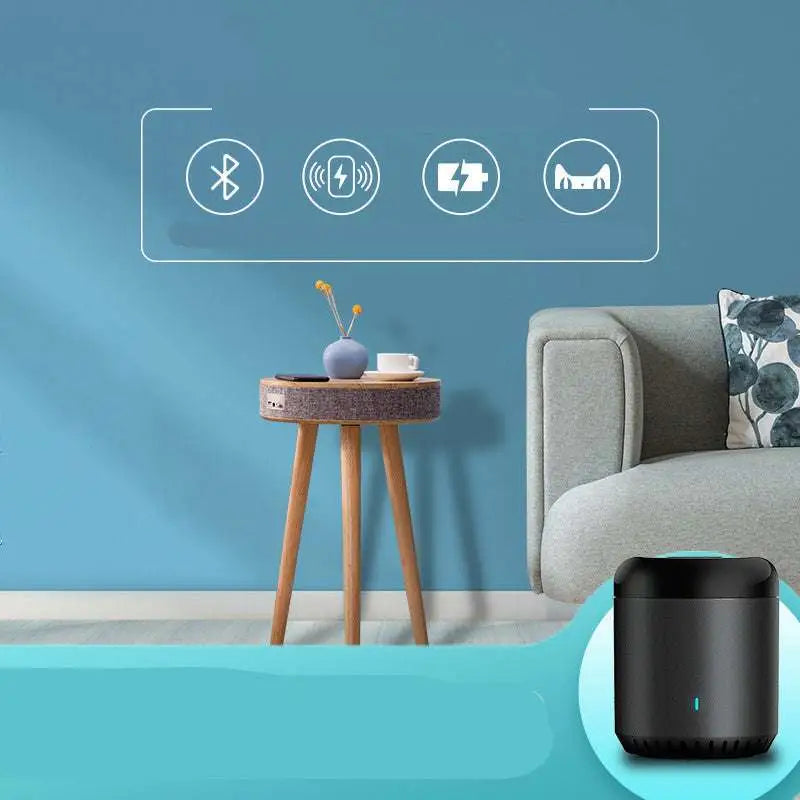 Black cylindrical smart speaker with glowing blue light on log color smart side table with wireless charging and gray textured fabric
