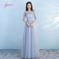 Long bridesmaid blue lace dress with three-quarter sleeves and flowing tulle skirt for blue wedding dress occasions