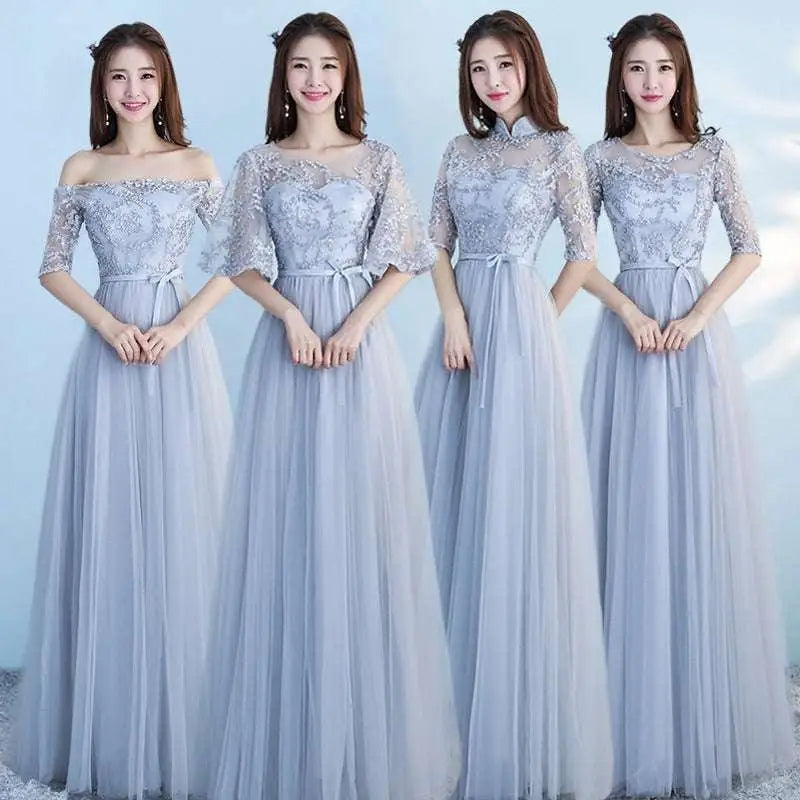 Elegant long bridesmaid blue lace and tulle dress with sleeves featuring delicate embroidery and matching sash details