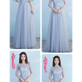 A long bridesmaid blue lace and tulle dress with three-quarter sleeves and a fitted bodice for blue wedding dress events