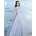 Long bridesmaid blue lace and tulle dress with sheer cap sleeves and a voluminous skirt for weddings