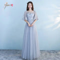 Long bridesmaid blue lace and tulle evening gown with delicate flutter sleeves perfect for blue wedding dress occasions