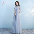 Long bridesmaid blue lace dress with high collar, three-quarter sleeves, embroidered bodice, and flowing tulle skirt