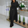 Black longline cardigan sunken stripe with a drawstring waist paired with wide leg pants in an elegant monochrome set