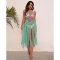 A vibrant turquoise long fringed panel beach blouse crochet dress with colorful geometric pattern over white bikini