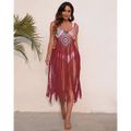 A vibrant long fringed panel beach blouse crochet dress in multicolored red and blue with fringe detailing