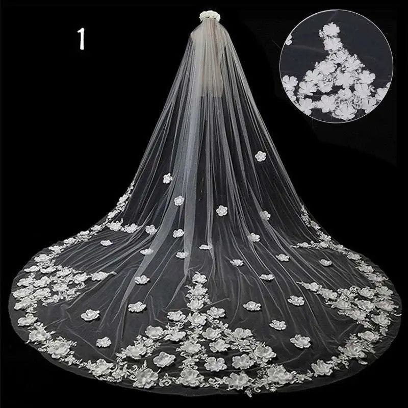 Long lace wedding veil meters wide with delicate white lace and intricate floral embroidery draped over a mannequin