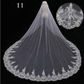 Long lace wedding veil in white with intricate floral embroidery on lace wedding veil edges for elegant bridal wear