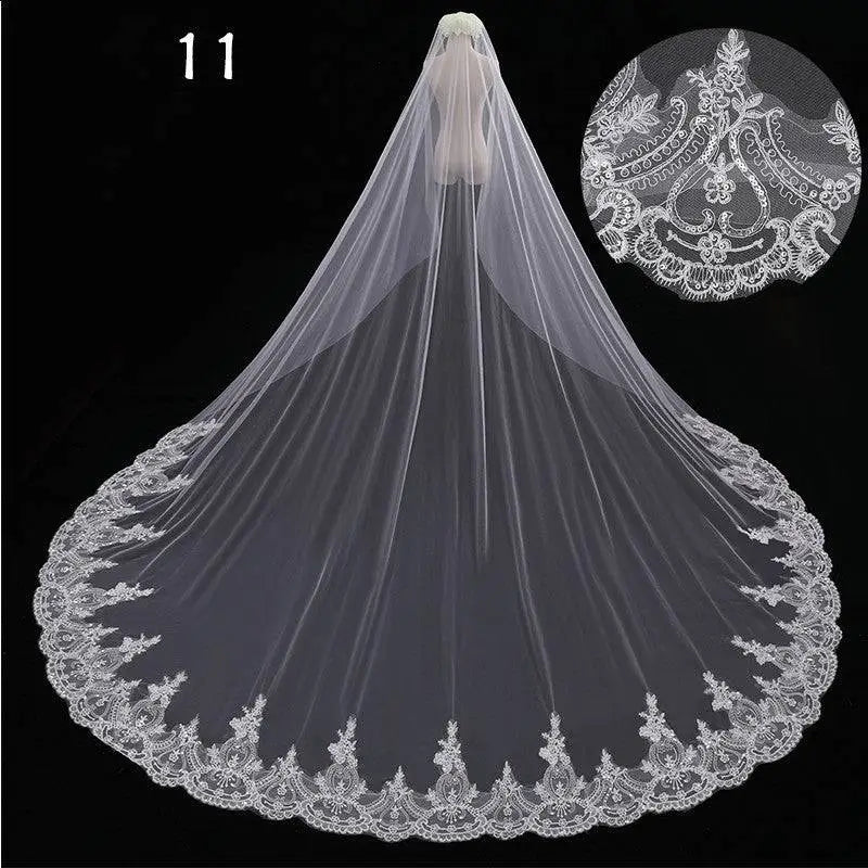 Long lace wedding veil in white with intricate floral embroidery on lace wedding veil edges for elegant bridal wear
