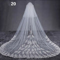 Long lace wedding veil with delicate white lace and intricate floral embroidery along the hemline