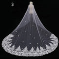 Long lace wedding veil in white lace with intricate floral embroidery and scattered pearl embellishments meters wide
