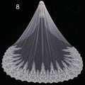 Long lace wedding veil in white with intricate floral embroidery and delicate scalloped edge design