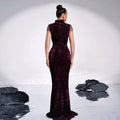A deep purple long sleeve banquet sequined rhinestone fishtail gown in shimmering burgundy velvet with sheer dotted sleeves