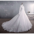 White lace wedding dress with long sleeve lace, high neckline, and intricate floral embroidery bridal gown with large tail