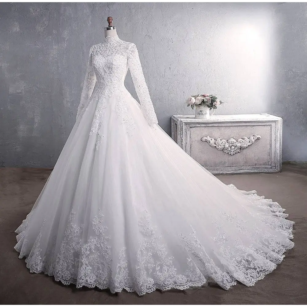 Elegant white lace wedding dress with long sleeves high neckline and intricate floral embroidery for bridal gown