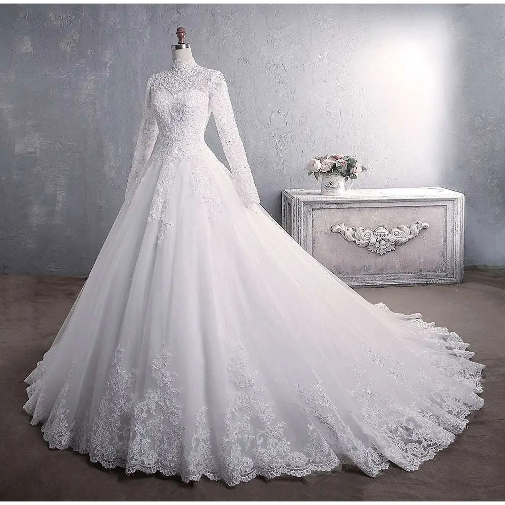 Long sleeve lace white wedding dress with high neckline and floral embroidery for elegant bridal gown look