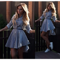 Long sleeve striped shirt dress in blue and white with a belted waist and asymmetrical hemline featuring bird illustrations