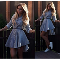 Long sleeve striped shirt dress with blue and white stripes and black belt featuring black bird illustrations