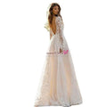 Elegant white wedding dress lace gown with long sleeves and deep back cutout showcasing delicate white long lace details