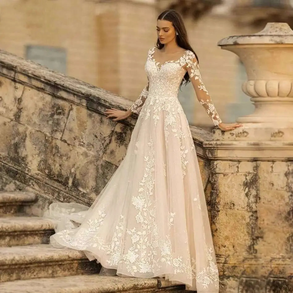 A flowing ivory lace long sleeve wedding dress mori style with intricate white floral lace on bodice sleeves and skirt