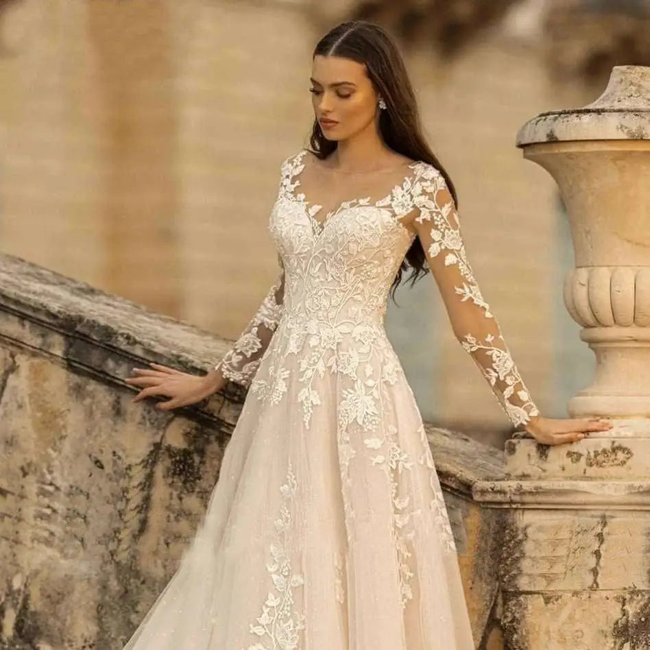 A delicate ivory lace long sleeve wedding dress mori style with sheer sleeves and intricate floral embroidery