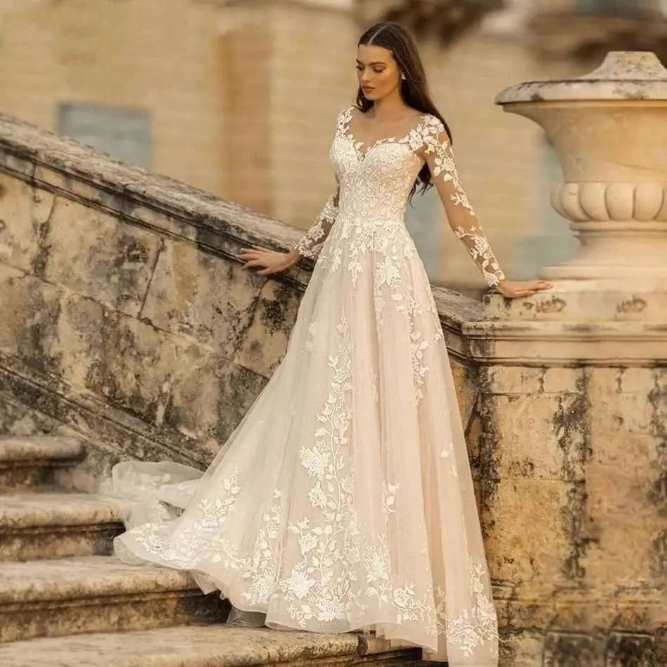 A long sleeve wedding dress mori style ivory lace gown with intricate white floral lace on bodice sleeves and skirt