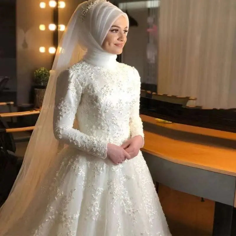 White lace dignified wedding dress featuring long sleeves floral embroidery and a high neckline for formal occasions