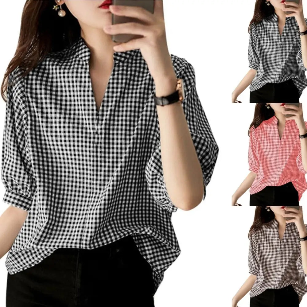 Black and white half sleeve plaid v neck blouse with relaxed fit and three quarter length sleeves for casual wear