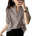 Loose casual half sleeve plaid v neck blouse in black and white checkered pattern with relaxed fit and three quarter sleeves